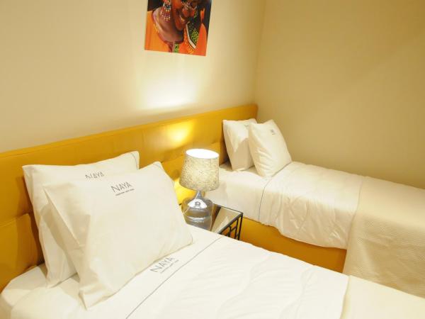 Naya-Downtown Guesthouse : photo 1 de la chambre chambre lits jumeaux