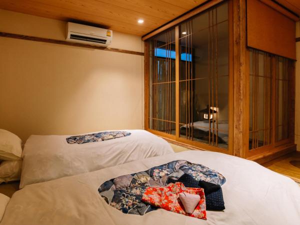 MAYU Bangkok Japanese Style Hotel : photo 7 de la chambre chambre double ou lits jumeaux deluxe – vue sur jardin