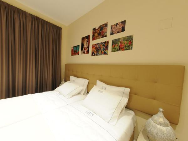 Naya-Downtown Guesthouse : photo 3 de la chambre chambre quadruple avec balcon