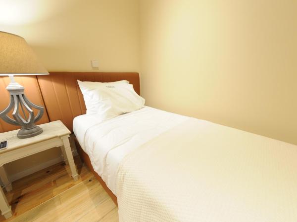 Naya-Downtown Guesthouse : photo 3 de la chambre chambre triple supérieure