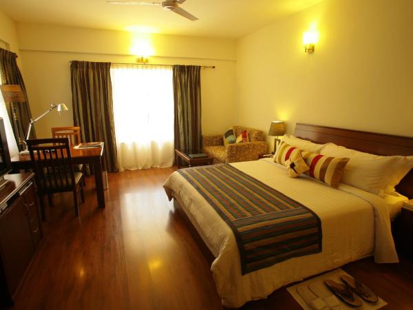 juSTa Off MG Road : photo 6 de la chambre chambre deluxe