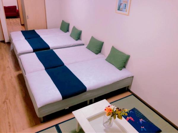 Mikawa House Osaka Castle : photo 1 de la chambre suite familiale