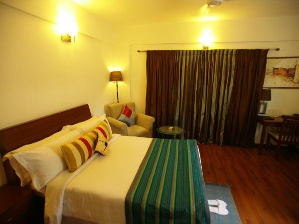 juSTa Off MG Road : photo 5 de la chambre chambre double de luxe