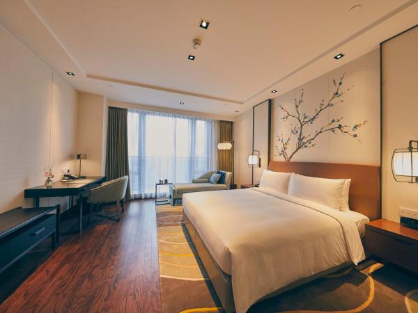 LJZ Supreme Tower Hotel : photo 1 de la chambre chambre lit queen-size deluxe