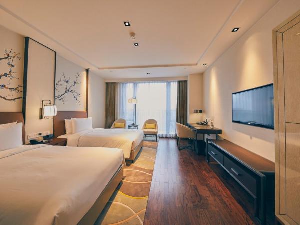 LJZ Supreme Tower Hotel : photo 2 de la chambre chambre lits jumeaux deluxe