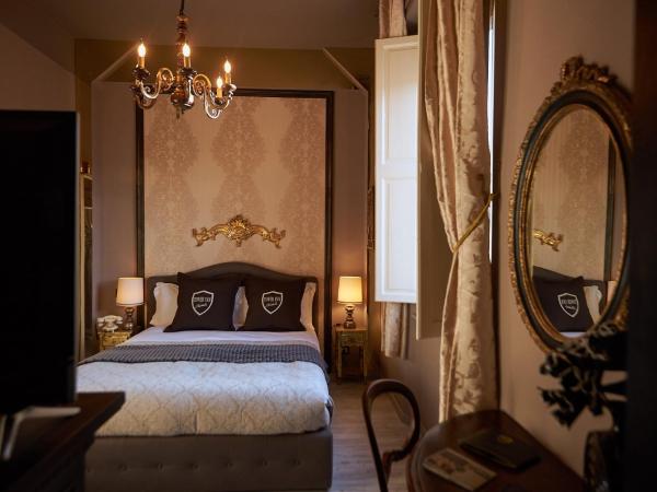 Villa Tower Inn : photo 1 de la chambre suite deluxe avec balcon