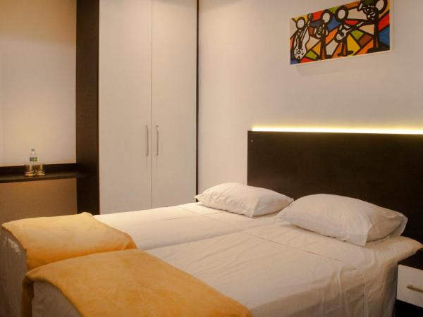 Bras Palace Hotel : photo 5 de la chambre chambre triple deluxe