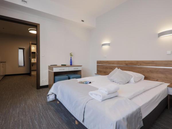 Kamienica Pod Aniołami : photo 3 de la chambre chambre deluxe double ou lits jumeaux