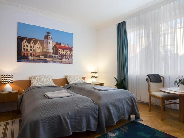 Bielski Guesthouse : photo 1 de la chambre chambre triple avec salle de bains commune