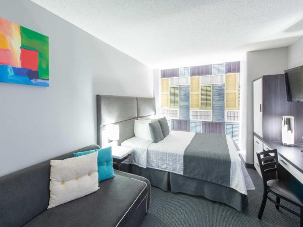 Travelodge by Wyndham Montreal Centre : photo 3 de la chambre chambre lit queen-size d'angle avec canapé-lit - non-fumeurs