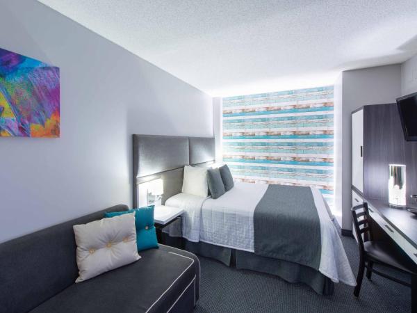 Travelodge by Wyndham Montreal Centre : photo 7 de la chambre chambre lit queen-size d'angle avec canapé-lit - non-fumeurs