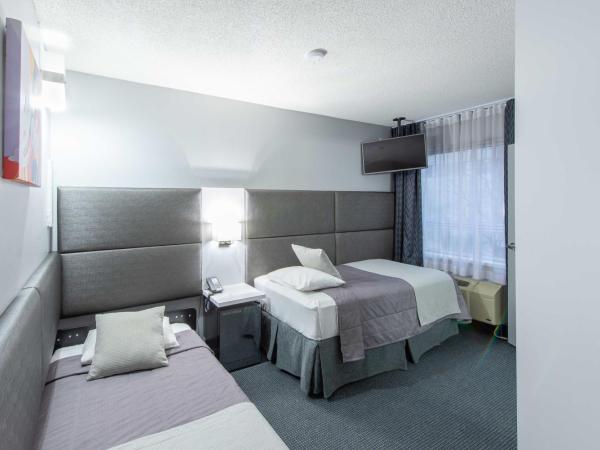Travelodge by Wyndham Montreal Centre : photo 2 de la chambre chambre lits jumeaux acessible aux personnes à mobilité réduite - non-fumeurs