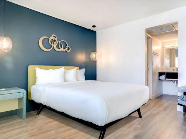 Downtowner Boutique Hotel : photo 1 de la chambre hébergement lit queen-size fairway