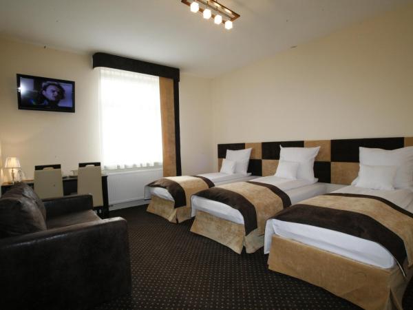 Boutique Hotel's I : photo 1 de la chambre chambre triple
