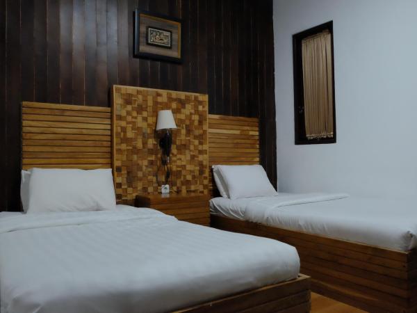 Puri Minggiran Guest House : photo 2 de la chambre chambre double Économique