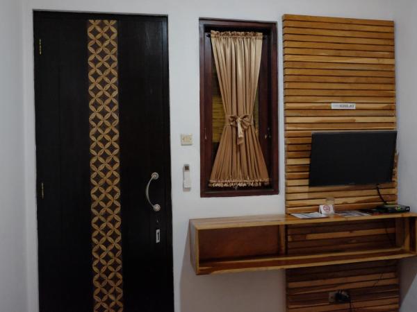 Puri Minggiran Guest House : photo 1 de la chambre chambre double Économique