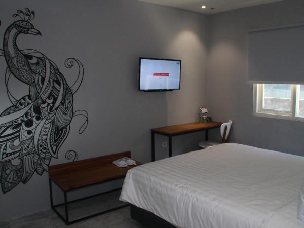 Nite & Day Surabaya - Kedungdoro : photo 6 de la chambre chambre double ou lits jumeaux supérieure