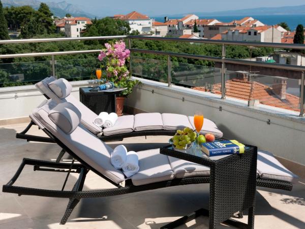 Boban Luxury Suites : photo 7 de la chambre suite avec baignoire spa et terrasse - vue sur mer