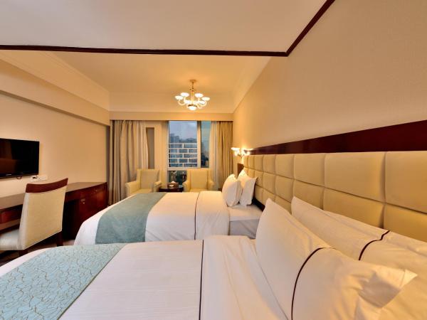 HaiJun Hotel -Free Canton Fair Shuttle Bus : photo 1 de la chambre chambre lits jumeaux de luxe avec vue sur la rivière
