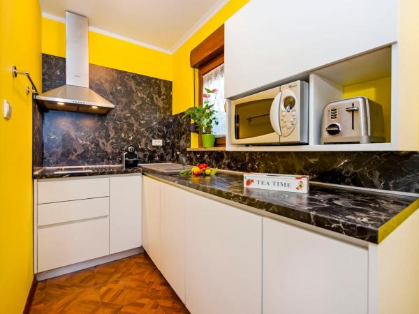 Apartments and Rooms Villa Dea ADULTS ONLY : photo 1 de la chambre appartement supérieur 1 chambre avec terrasse - vue sur jardin