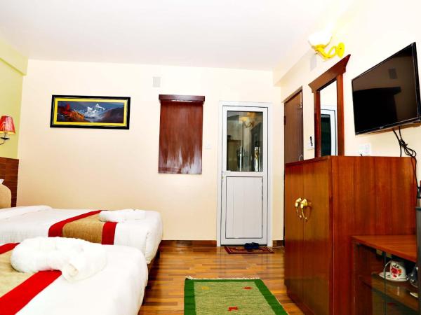 Hotel Guru : photo 4 de la chambre chambre triple deluxe