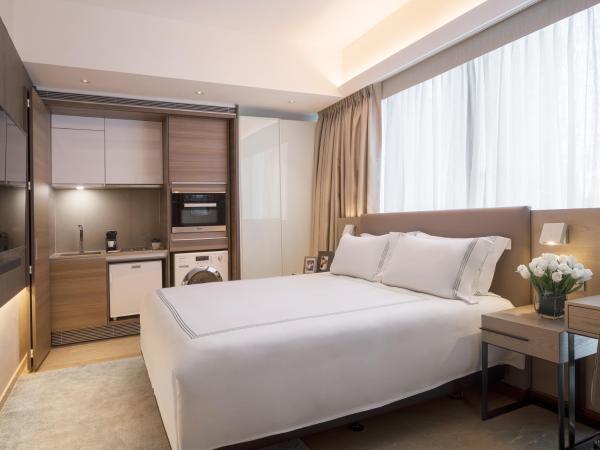 Fraser Residence Orchard Singapore : photo 1 de la chambre studio deluxe lit king-size