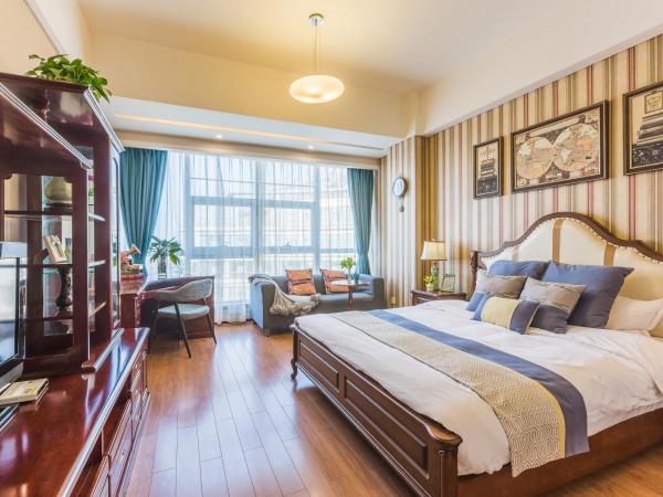 Westlake Service Apartment : photo 1 de la chambre chambre lit queen-size