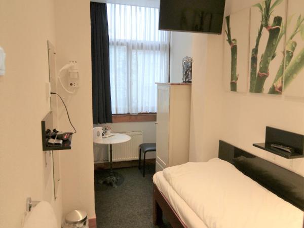 Hotel Bienvenue : photo 1 de la chambre chambre simple avec douche 