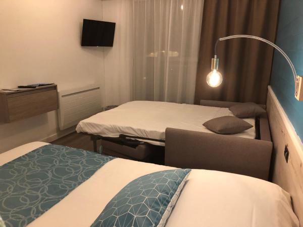 Hôtel La Côte Océane : photo 7 de la chambre chambre quadruple (2 adultes + 2 enfants)