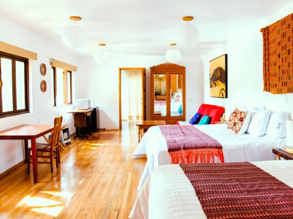 Casa Jacinta Guest House : photo 2 de la chambre chambre deluxe avec 2 lits doubles