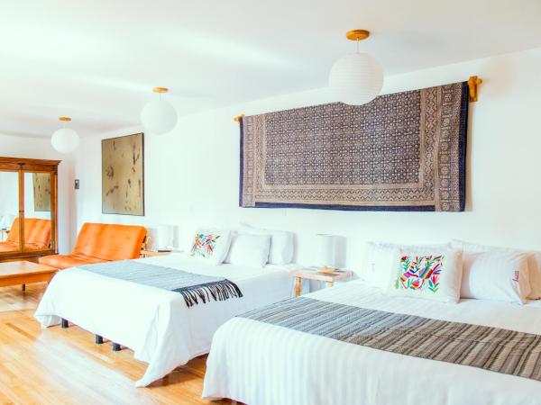 Casa Jacinta Guest House : photo 3 de la chambre chambre deluxe avec 2 lits doubles