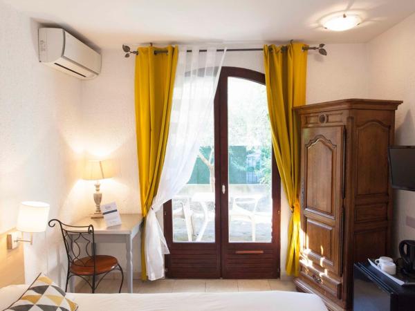 Motel Cap Sol : photo 5 de la chambre chambre double ou lits jumeaux classique avec vue sur le jardin