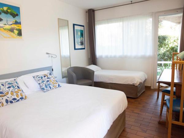 Motel Cap Sol : photo 2 de la chambre chambre triple confort (3 adultes) - vue sur jardin 