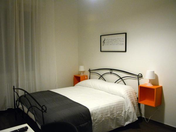 Mambo Suites : photo 5 de la chambre chambre double deluxe avec lit d'appoint