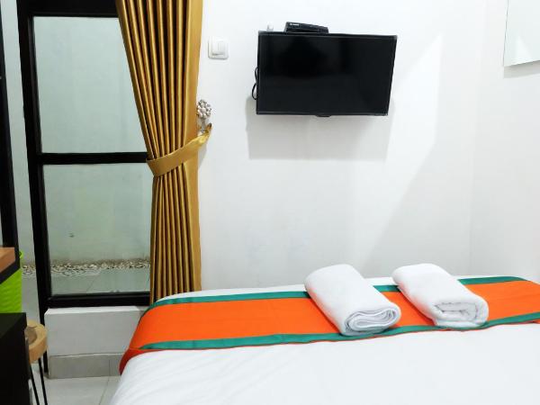 Hotel Jogja Kili Suci By Simply Homy : photo 9 de la chambre chambre supérieure lit queen-size