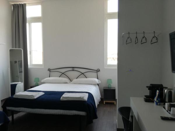 Mambo Suites : photo 4 de la chambre chambre quadruple avec salle de bains privative