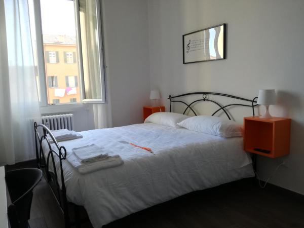 Mambo Suites : photo 3 de la chambre chambre double deluxe avec lit d'appoint