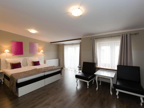 Leone Aparthotel : photo 1 de la chambre chambre quadruple