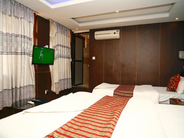 Traveler's Holiday Inn : photo 3 de la chambre deluxe