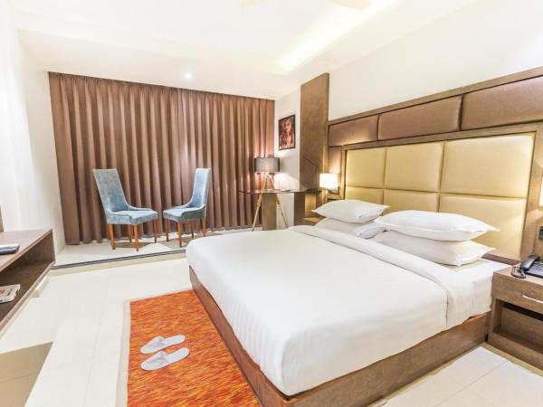 Aura One Hotel : photo 4 de la chambre chambre lit king-size deluxe