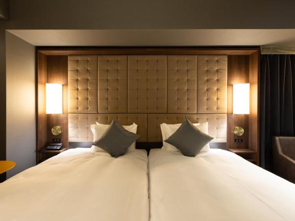 The Royal Park Canvas - Ginza 8 : photo 7 de la chambre chambre lits jumeaux deluxe