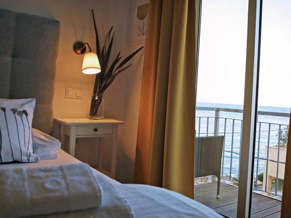 Hotel Delfin : photo 2 de la chambre chambre familiale (2 adultes et 2 enfants)