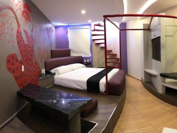 Motel Tatami : photo 1 de la chambre suite lit queen-size avec baignoire spa