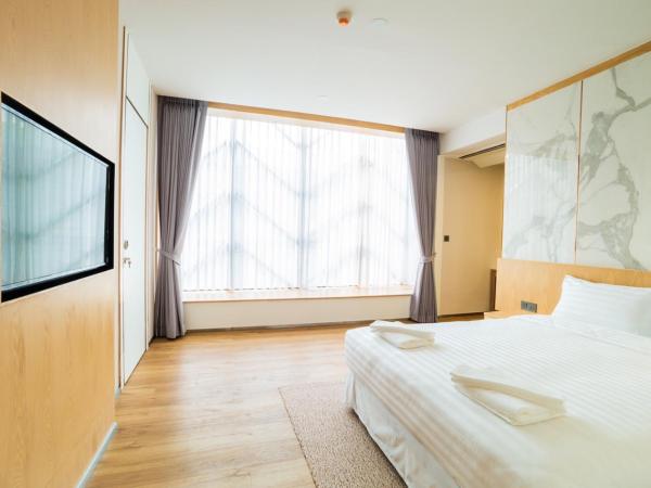 Artino Hotel Silom : photo 4 de la chambre chambre double deluxe - vue sur ville