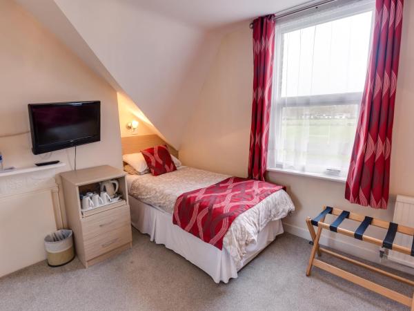 The Sportsview Guest House : photo 1 de la chambre chambre triple