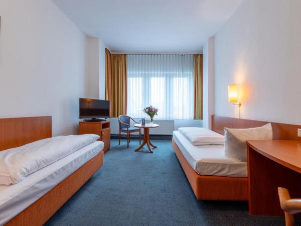 Trip Inn Hotel Schumann : photo 1 de la chambre chambre lits jumeaux