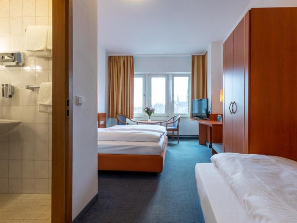 Trip Inn Hotel Schumann : photo 4 de la chambre chambre triple