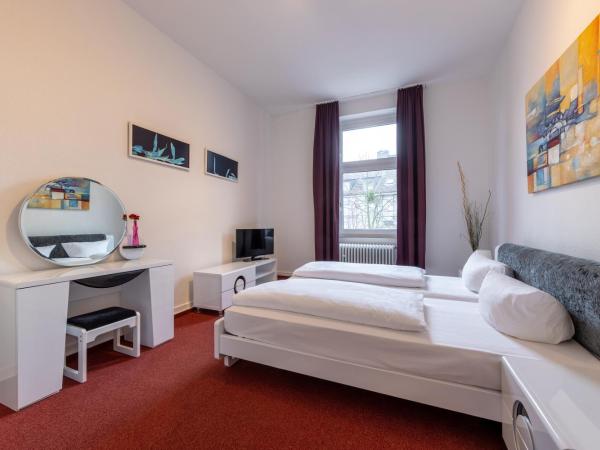 Trip Inn Hotel Schumann : photo 1 de la chambre chambre familiale