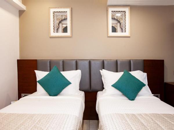 Mango Suites Viera : photo 7 de la chambre chambre deluxe double ou lits jumeaux