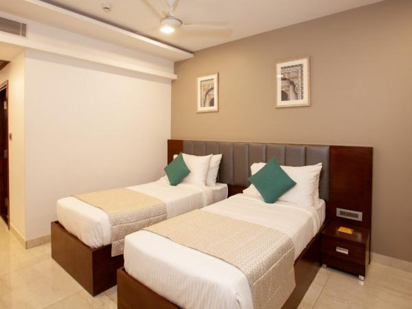 Mango Suites Viera : photo 9 de la chambre chambre deluxe double ou lits jumeaux